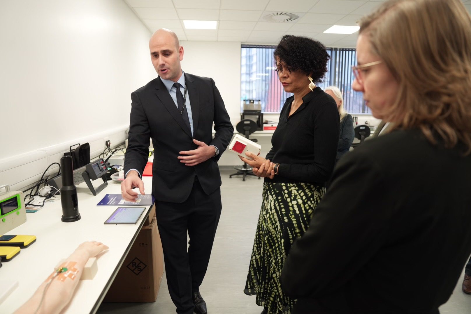 Patryk Kot, Business Development Manager at iiCON demonstrating sensor technology iiTECH to, Chi Onwurah MP, Select Committee Chair.